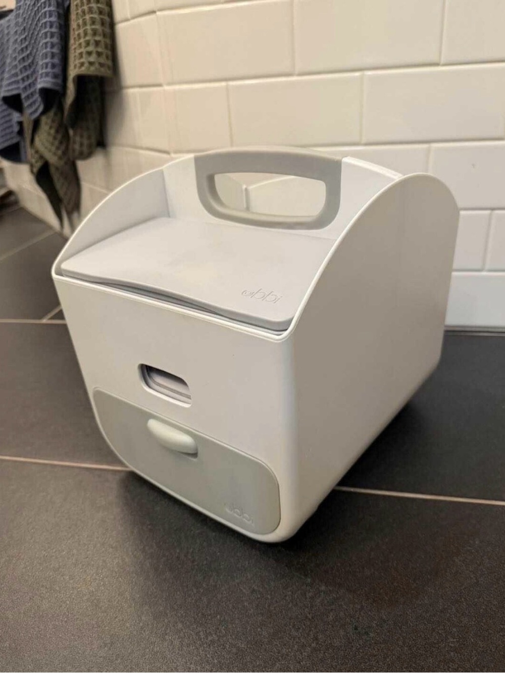 Ubbi diaper caddy and wipe dispenser